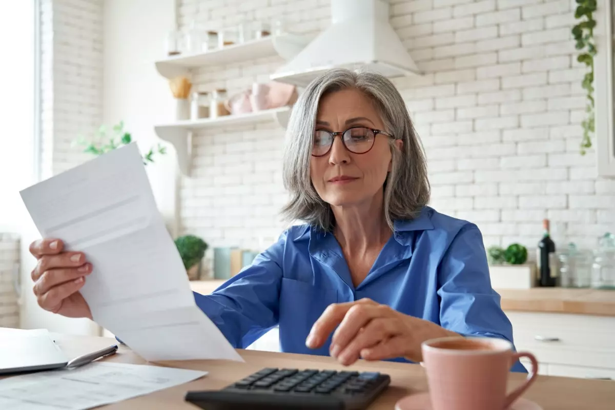 woman looking over savings account