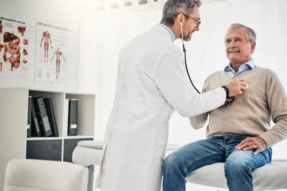 man having blood pressure checked 